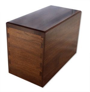 A wooden box is sitting on a white surface