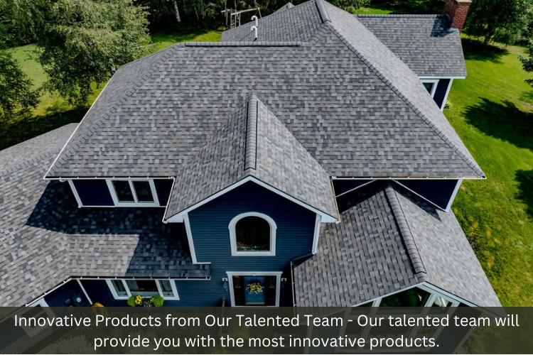An aerial view of a large house with a gray roof