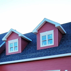 A red house with a blue roof and white trim