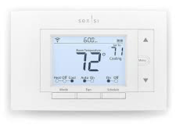 A white thermostat is sitting on a white surface.