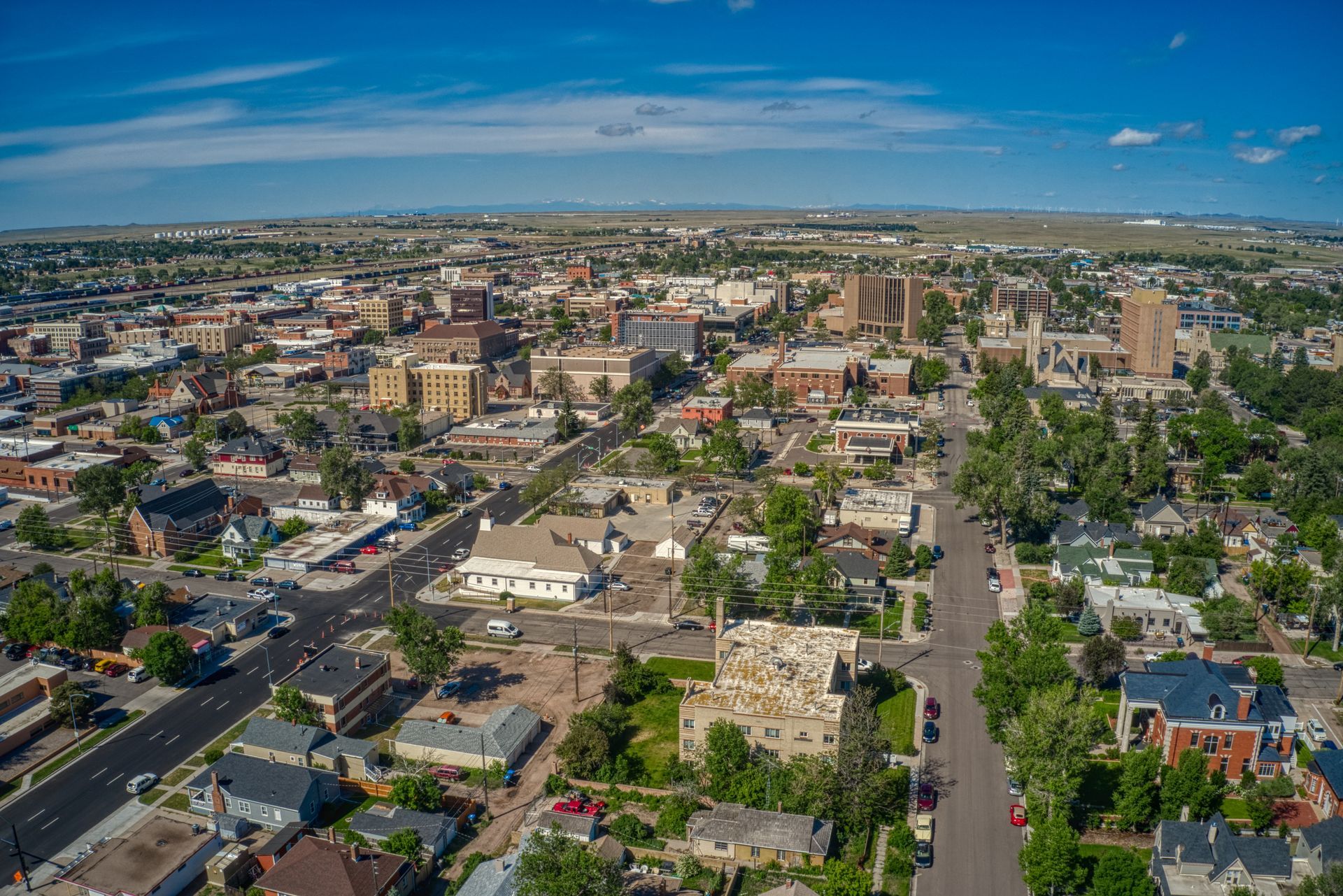 an aerial view of a city with a lot of buildings and trees .