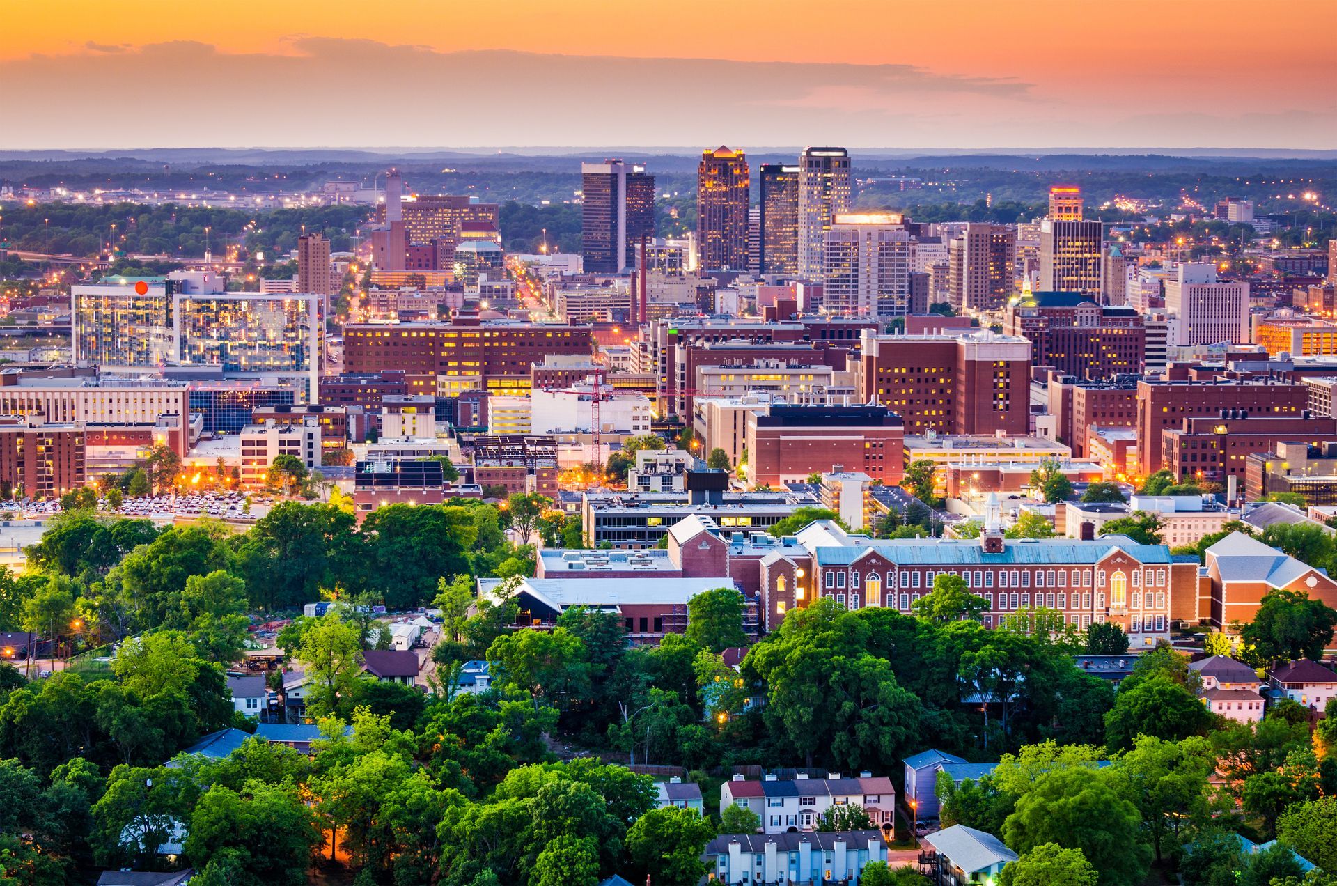 an aerial view of a city with a lot of buildings and trees