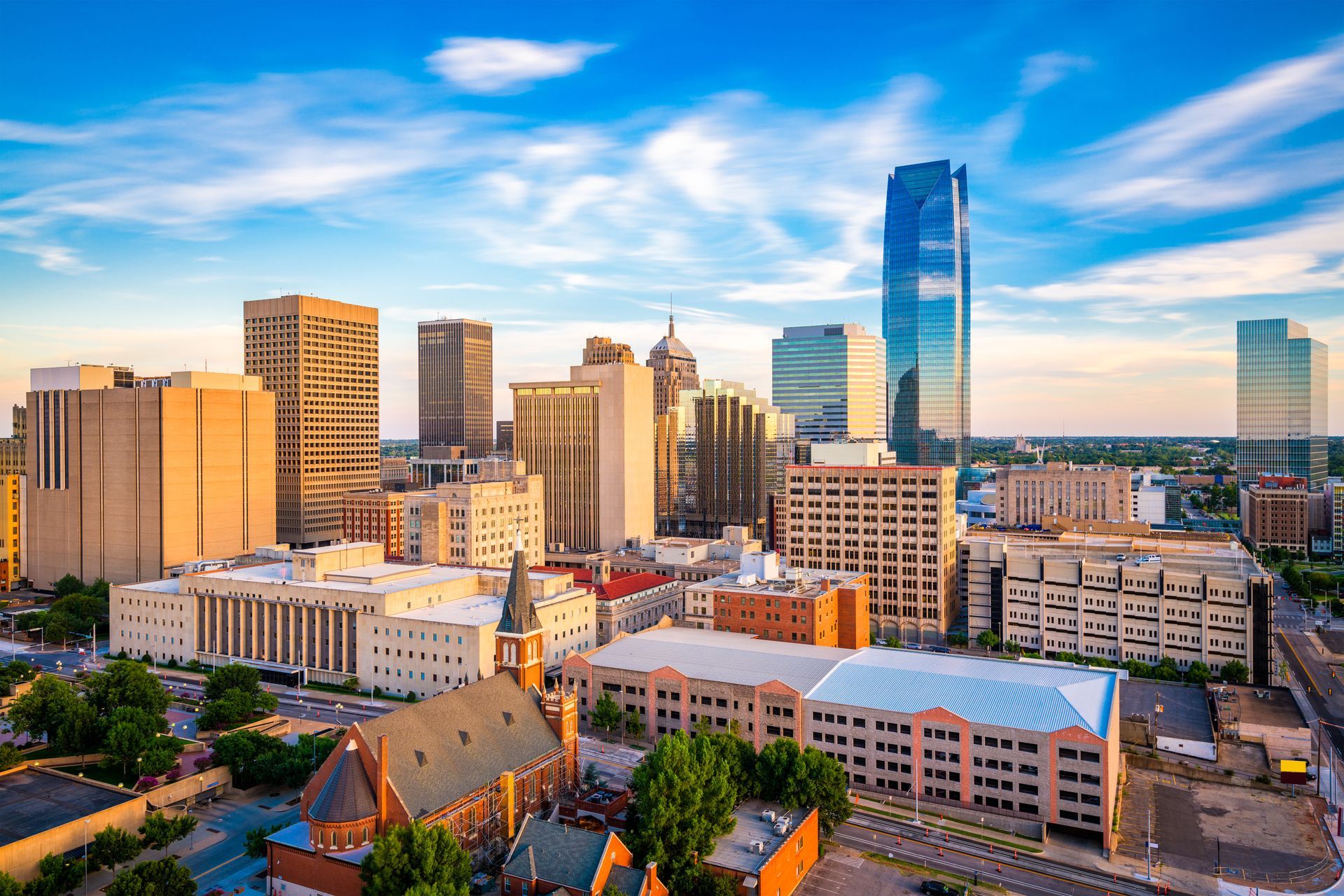 an aerial view of a city skyline with a church in the foreground .