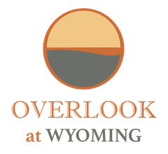 Logo: a circle split horizontally with tan and gray sections. Below are the words