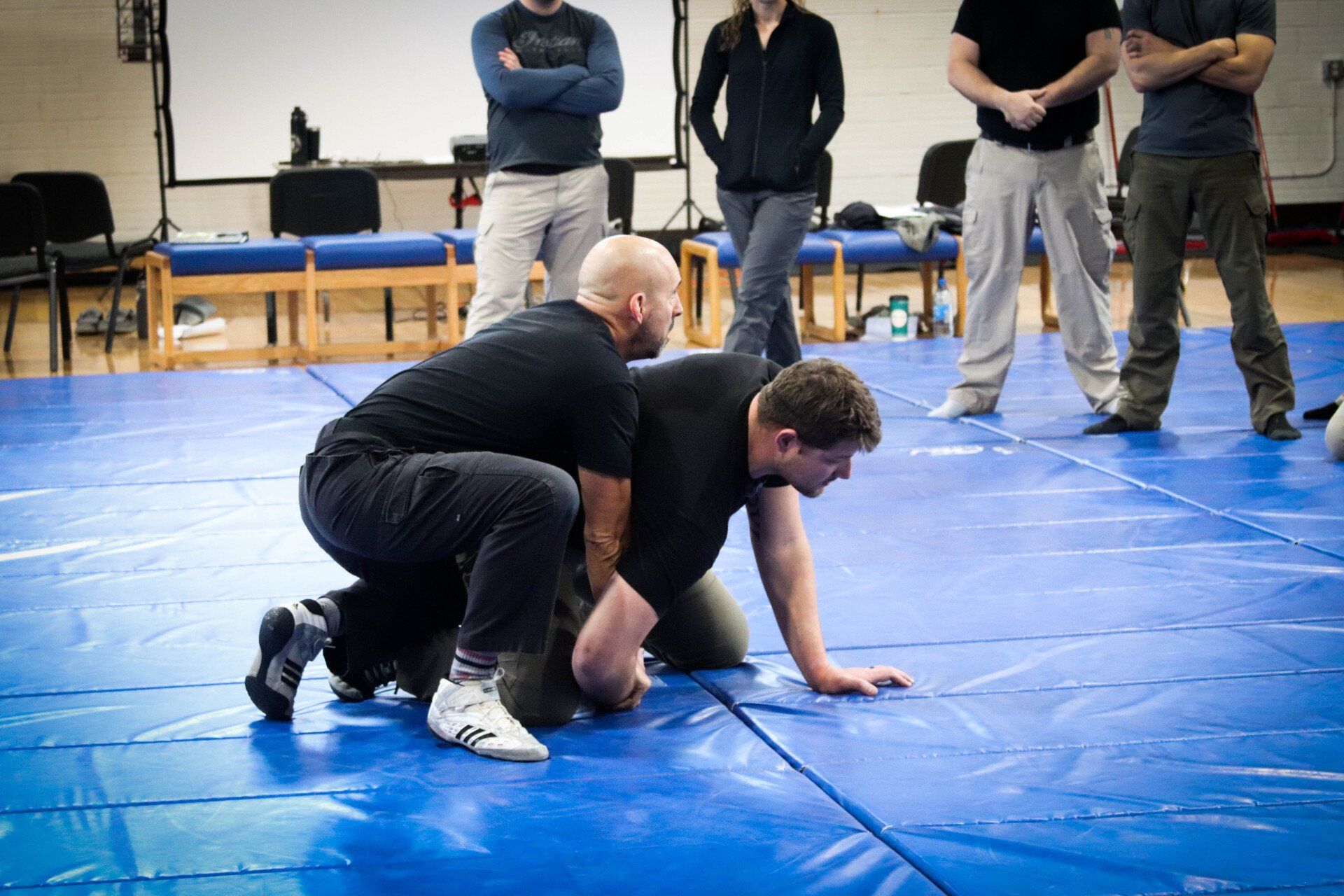 instructor demonstrating ground tactics