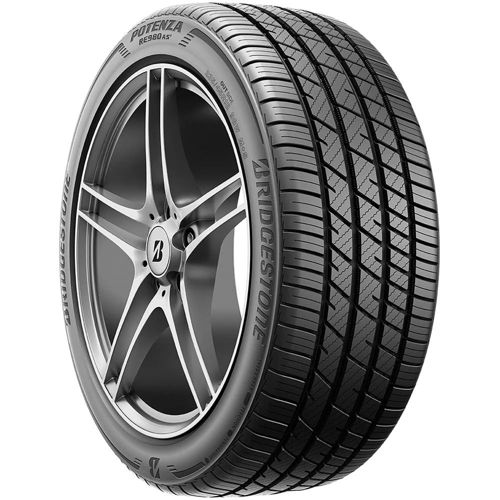 A close up of a bridgestone tire on a white background