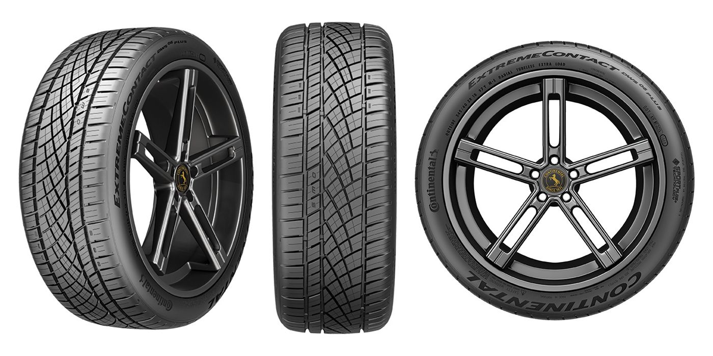 A close up of a tire and wheel on a white background.