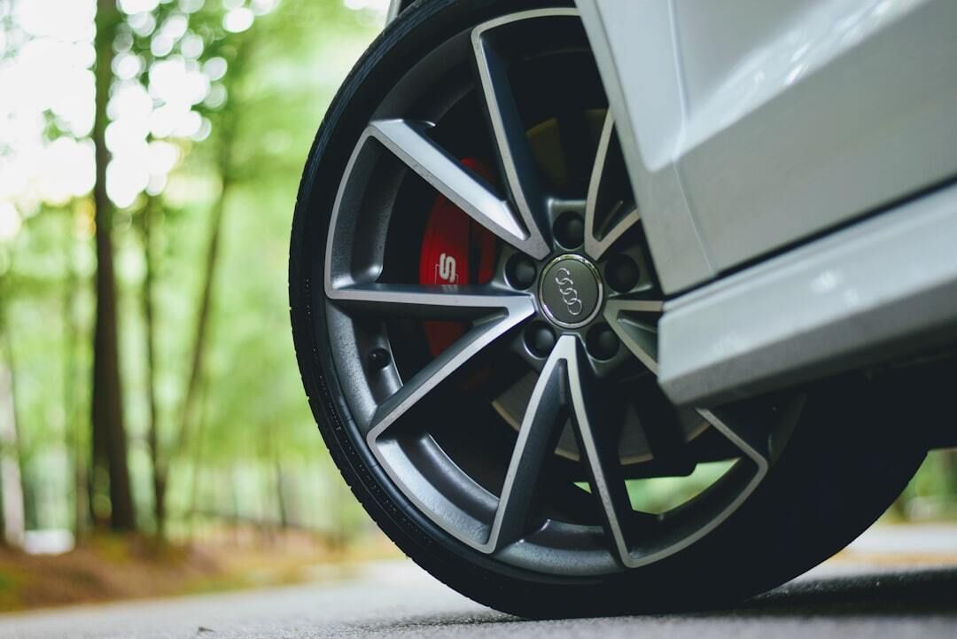 A close up of a car wheel on a road