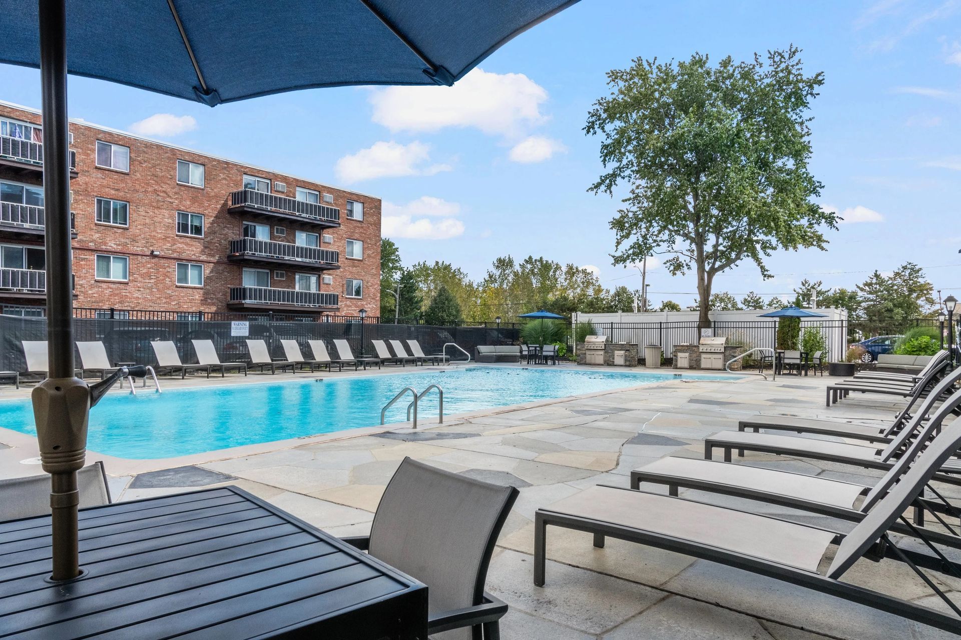 Poolside lounge seating at Northgate Apartments.