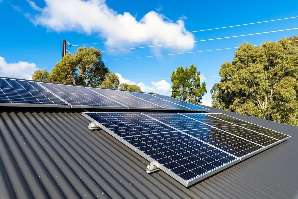 There Are Many Solar Panels On The Roof Of A House — J T Walker Solar & Electrical In Old Bar, NSW