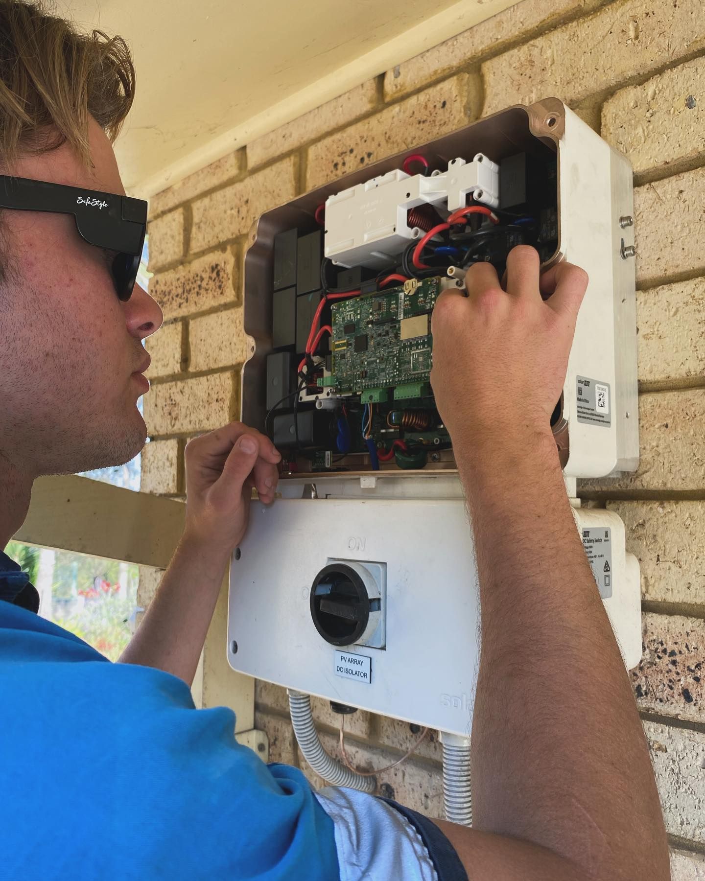 A Man is Working on a Electric Outage — J T Walker Solar & Electrical In Gloucester, NSW