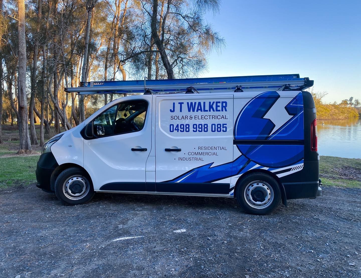 A White J T Walker Van Is Parked In A Parking Lot — J T Walker Solar & Electrical In Taree, NSW