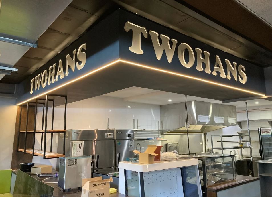 A Kitchen With a Sign That Says Twohans on It — J T Walker Solar & Electrical In Taree, NSW