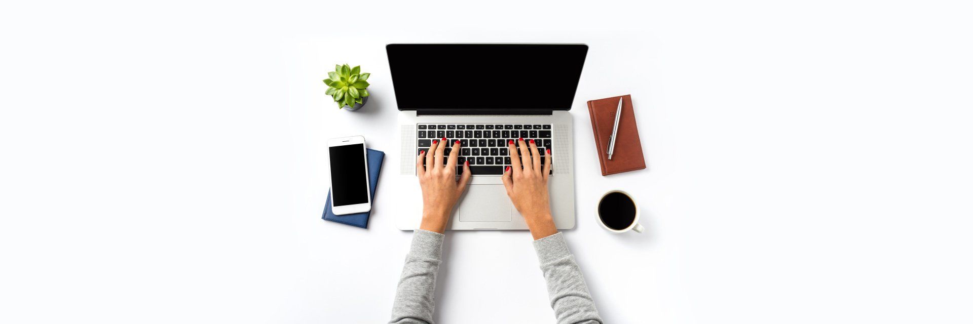 A person is typing on a laptop computer.