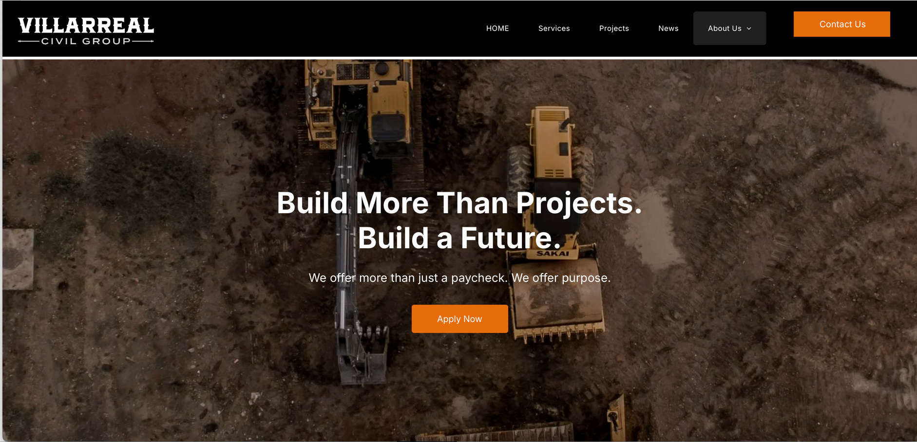 Construction equipment on a brown terrain, with text 