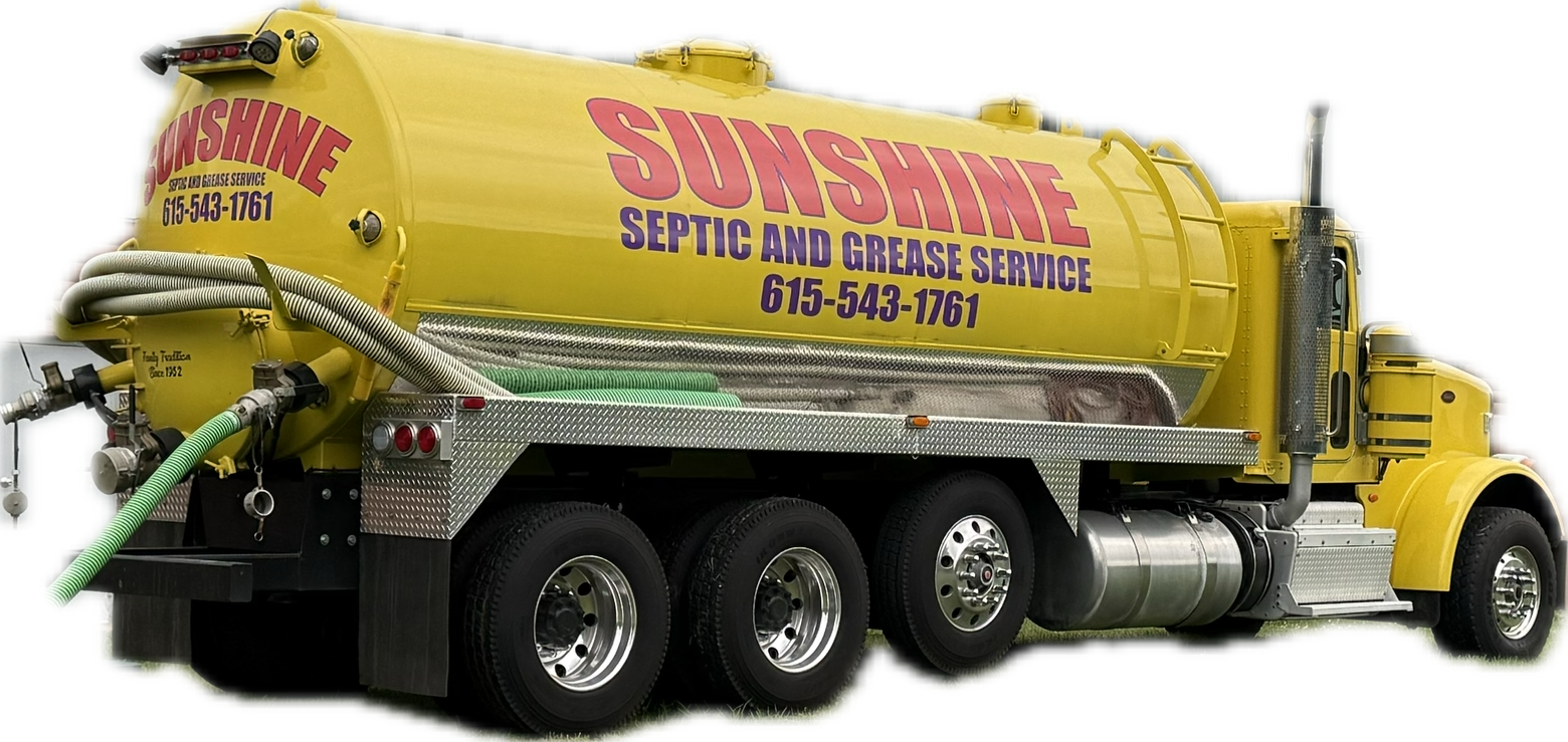 Yellow septic service truck with pink lettering and multiple rear axles on a white background