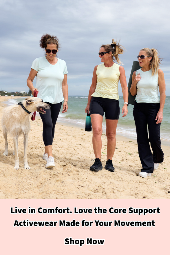 Three women walking on the beach in activewear designed with flattering fits for comfortable movement and core support.