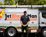 Jet Blaster Man's car parked in front of a house