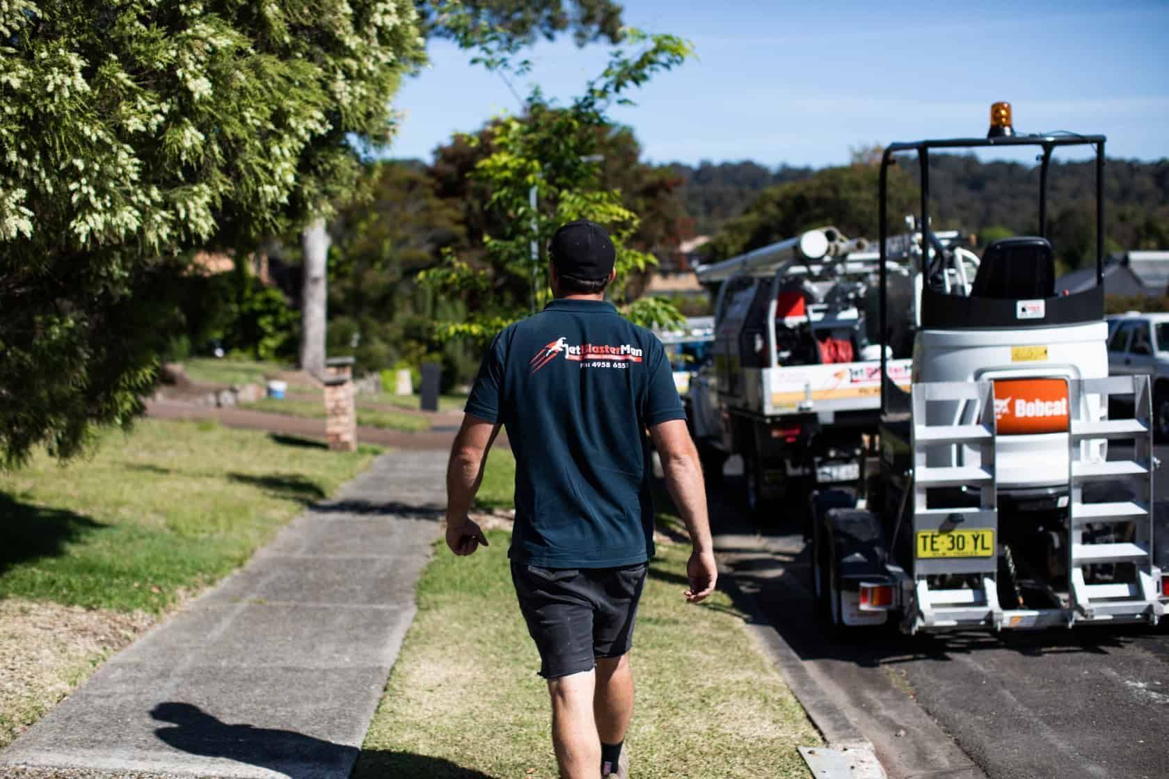 Jetblasterman walks past plumbing equipment