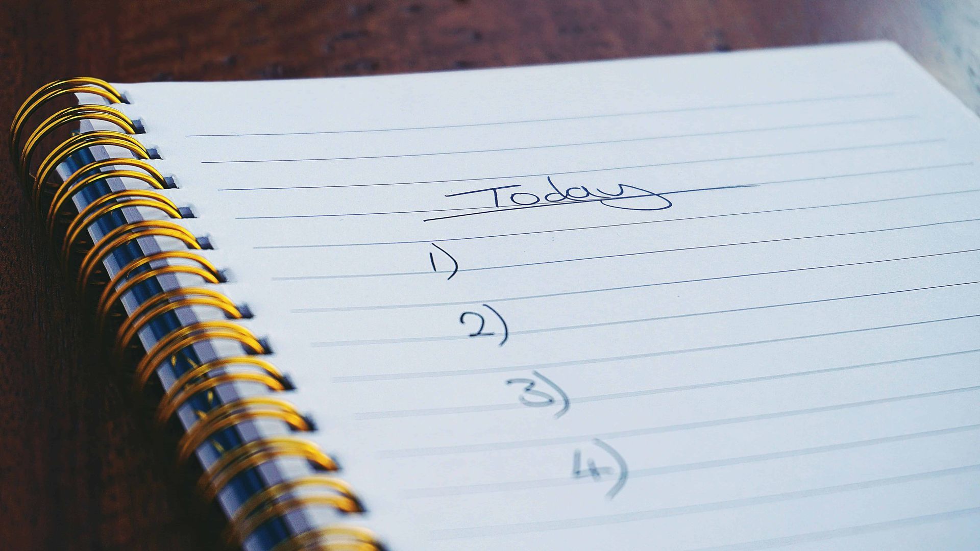 A simple checklist written in a white notebook