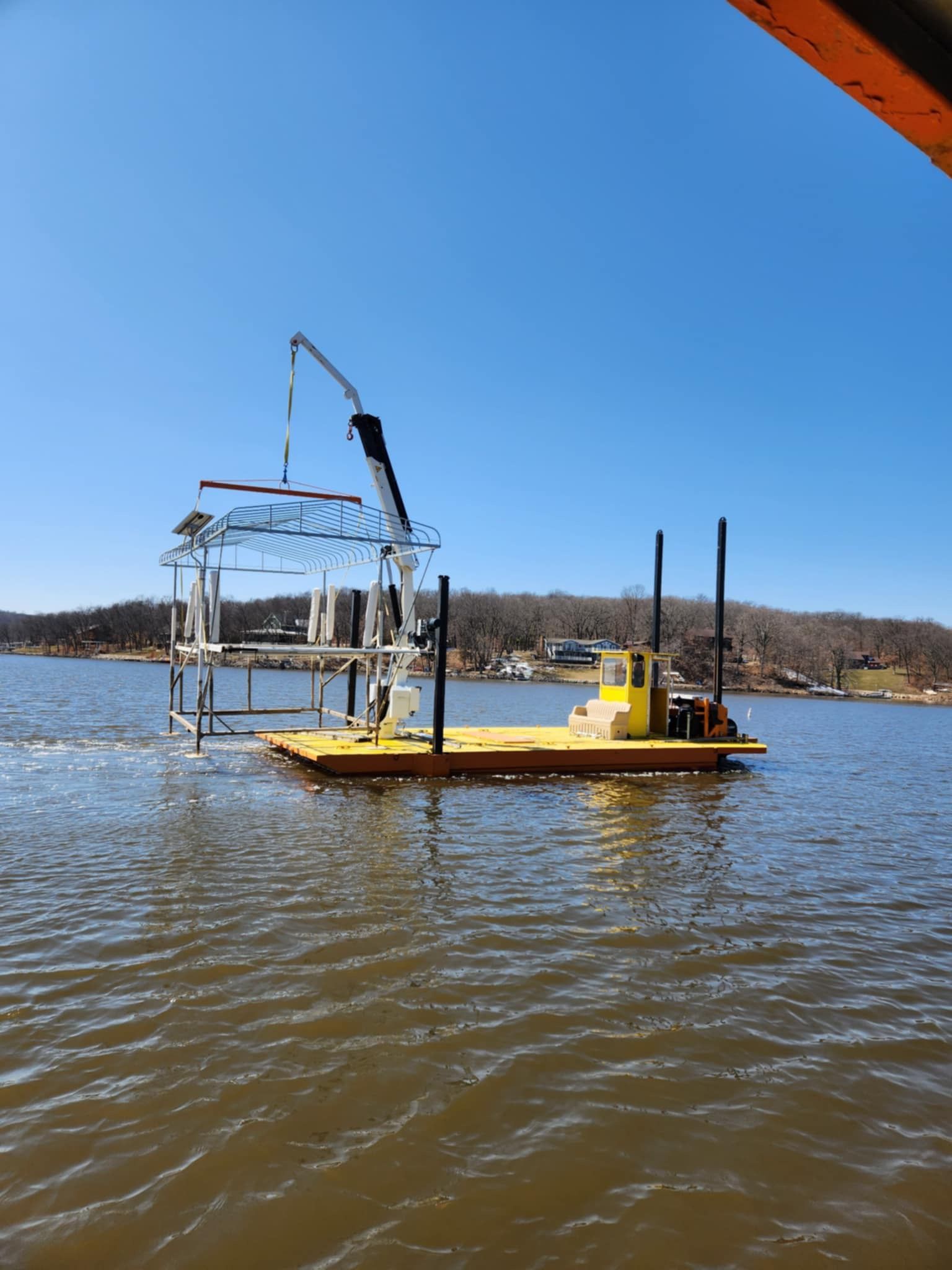 A yellow boat is floating on top of a body of water.