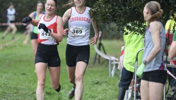 A group of women are running in a cross country race.