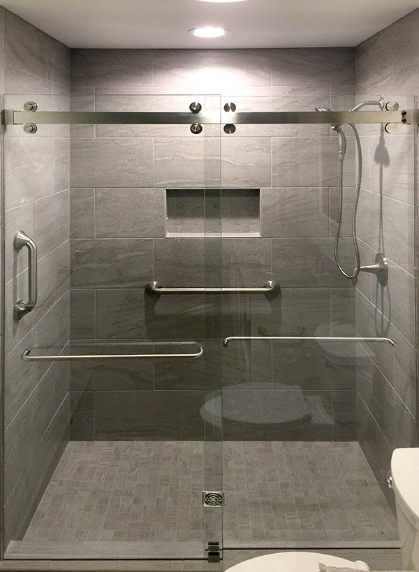 Sliding shower enclosure