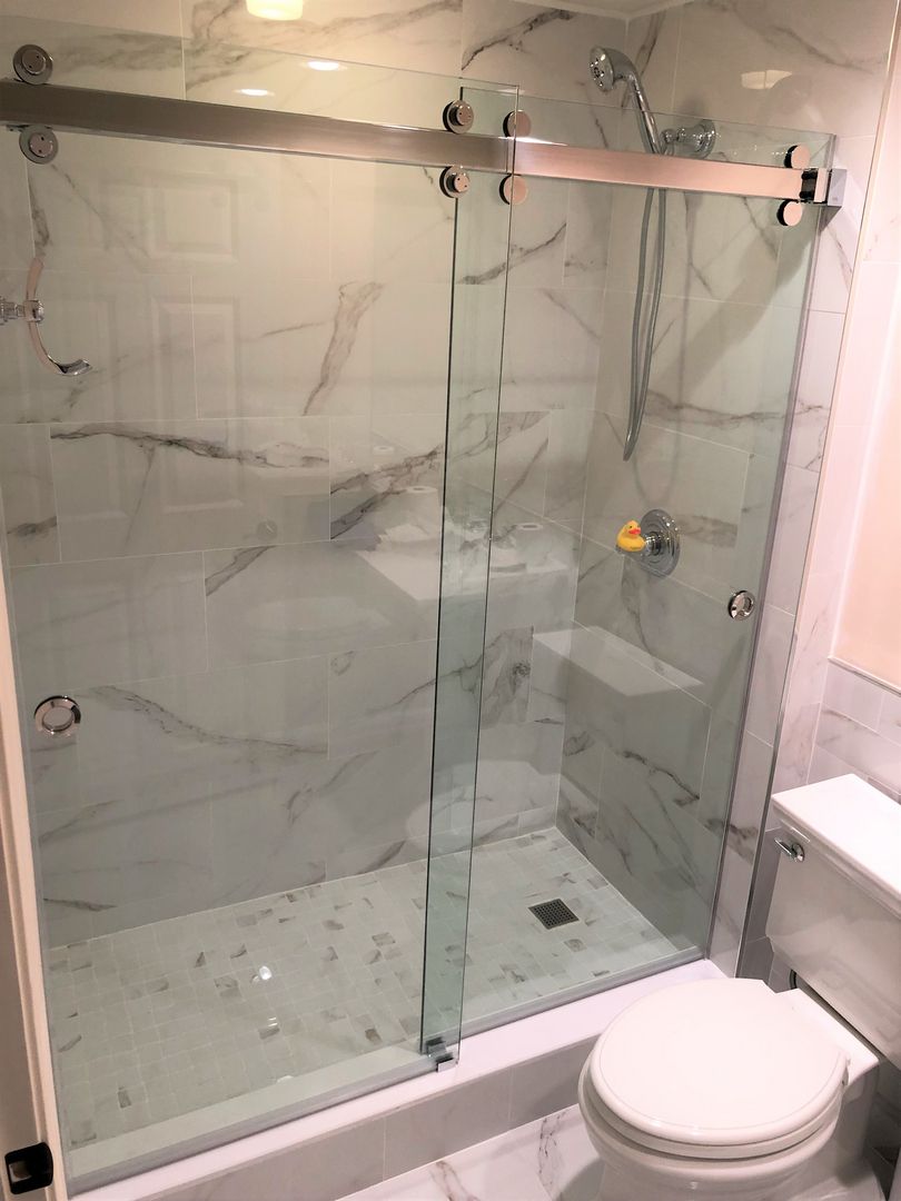 Sliding shower enclosure