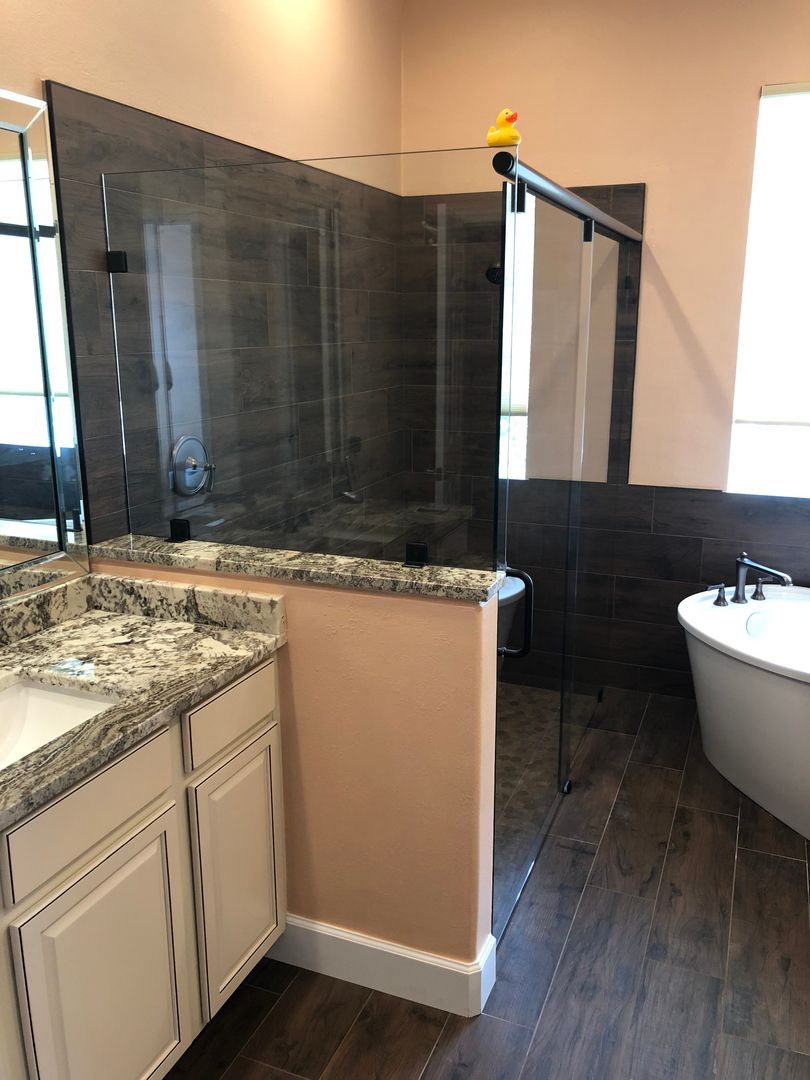 Sliding shower enclosure