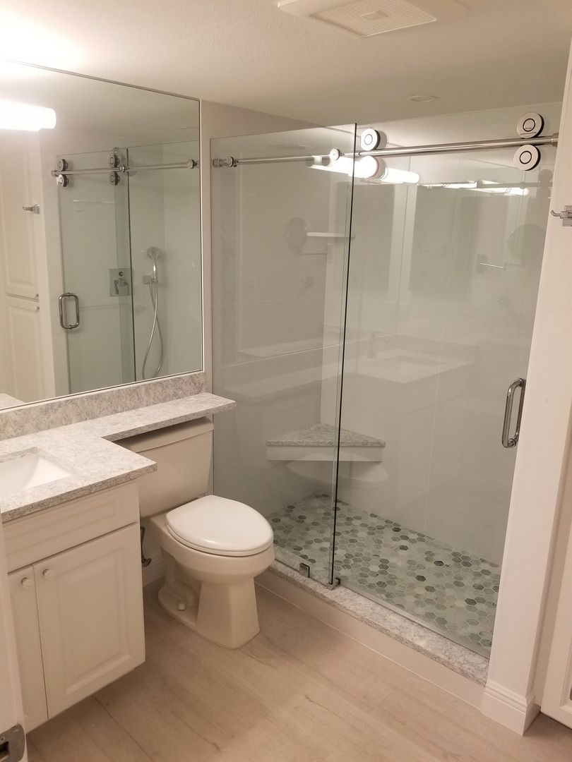 Sliding shower enclosure