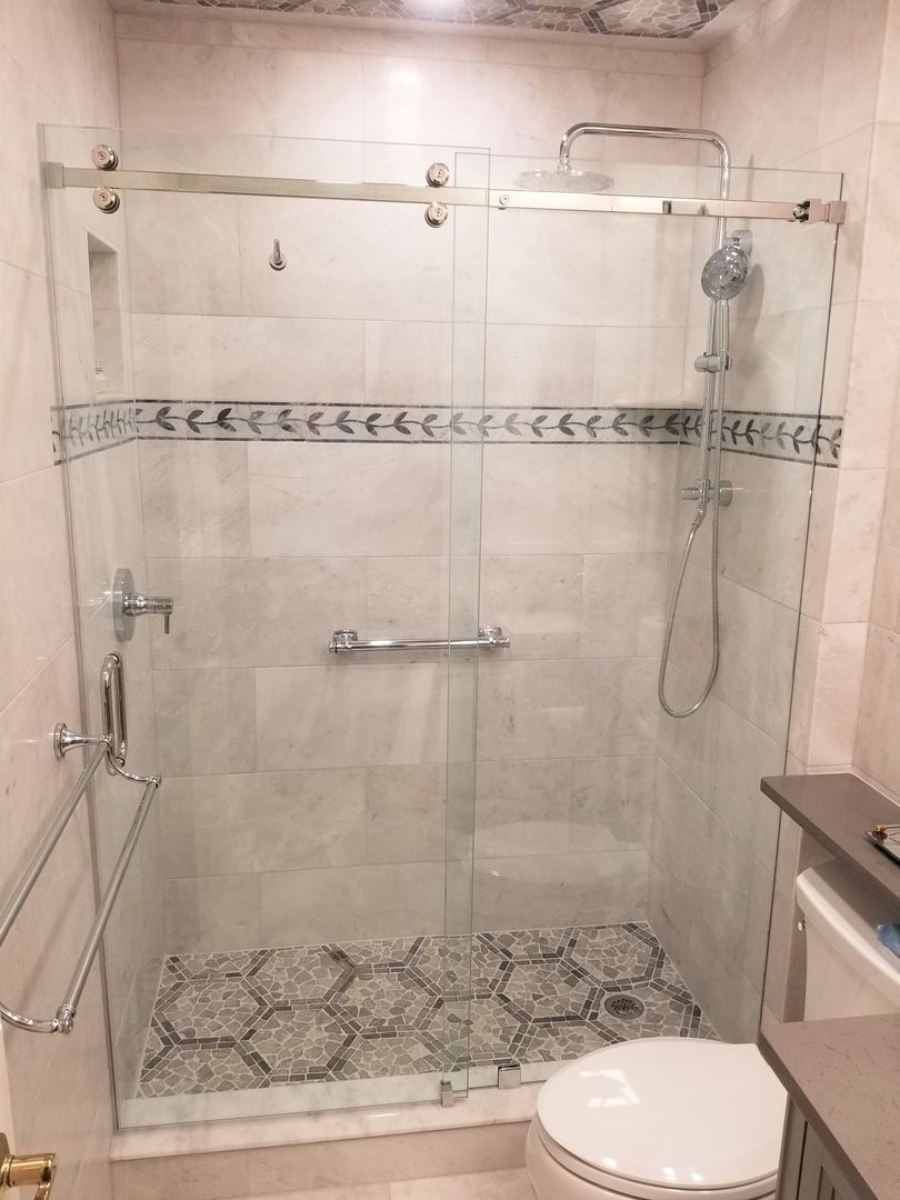 Sliding shower enclosure