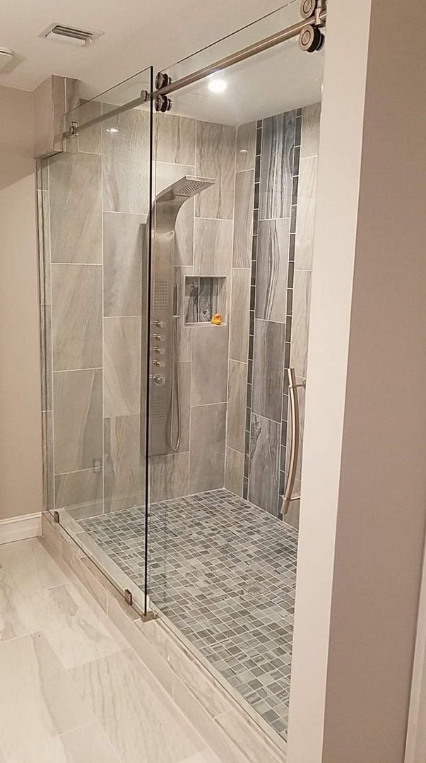 Sliding shower enclosure