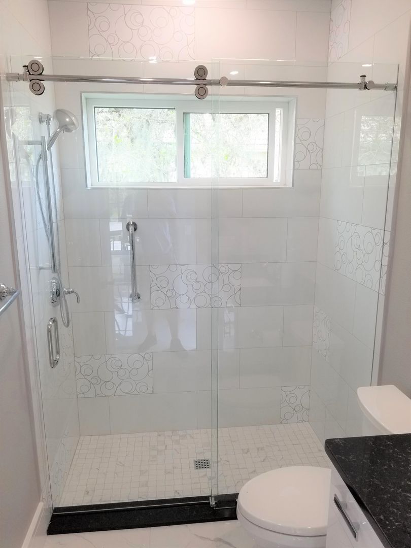 Sliding shower enclosure
