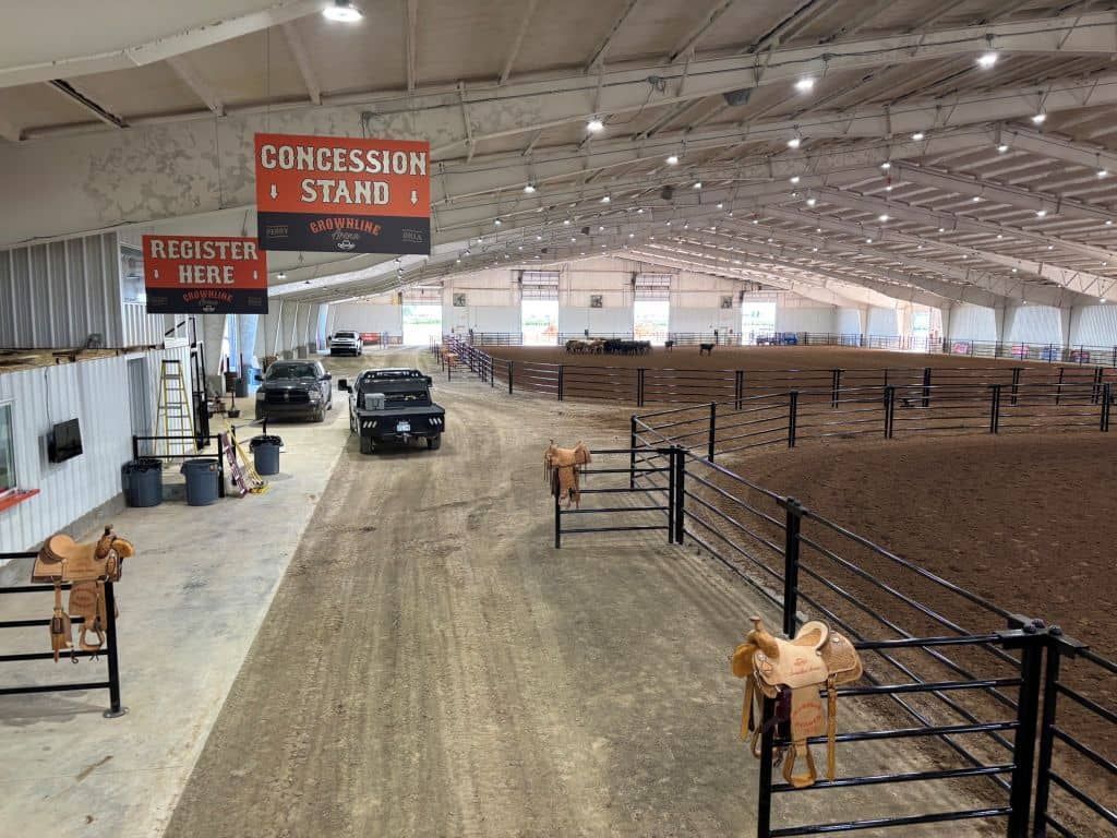 A large indoor arena with a sign that says concession stand.