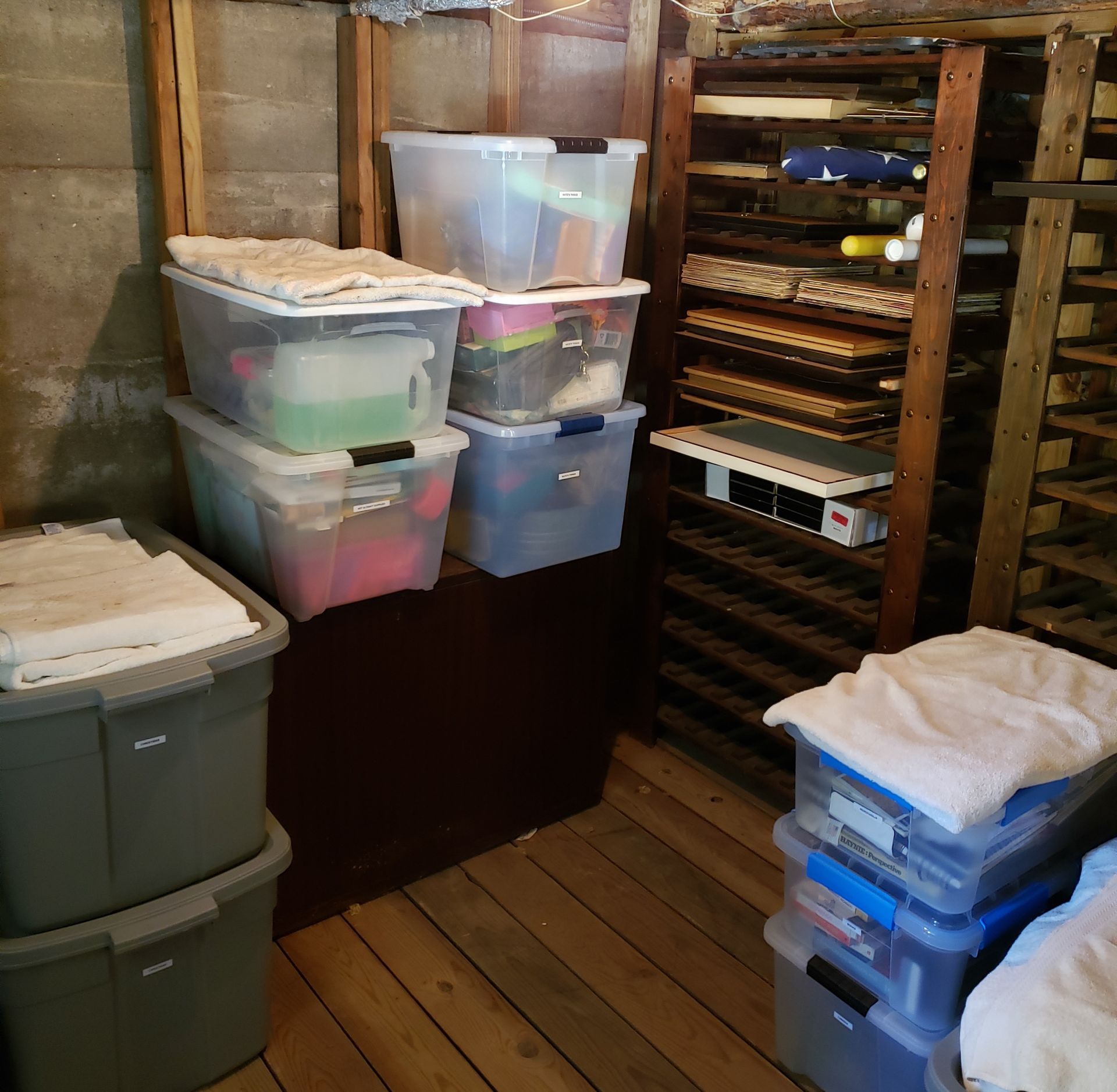 A bunch of plastic bins are stacked on top of each other