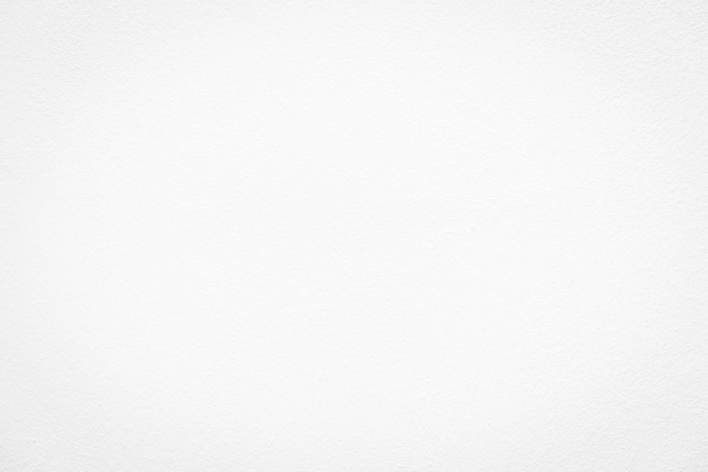 A close up of a white paper texture.