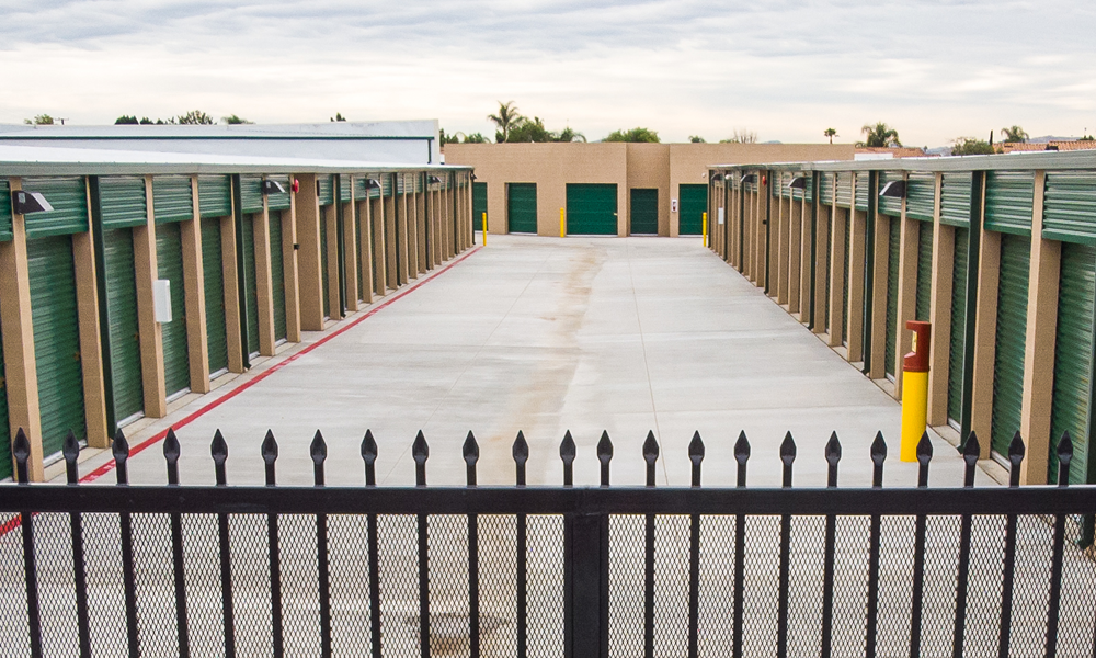 Row of storage units behind secure fence at Moreno Valley Storage