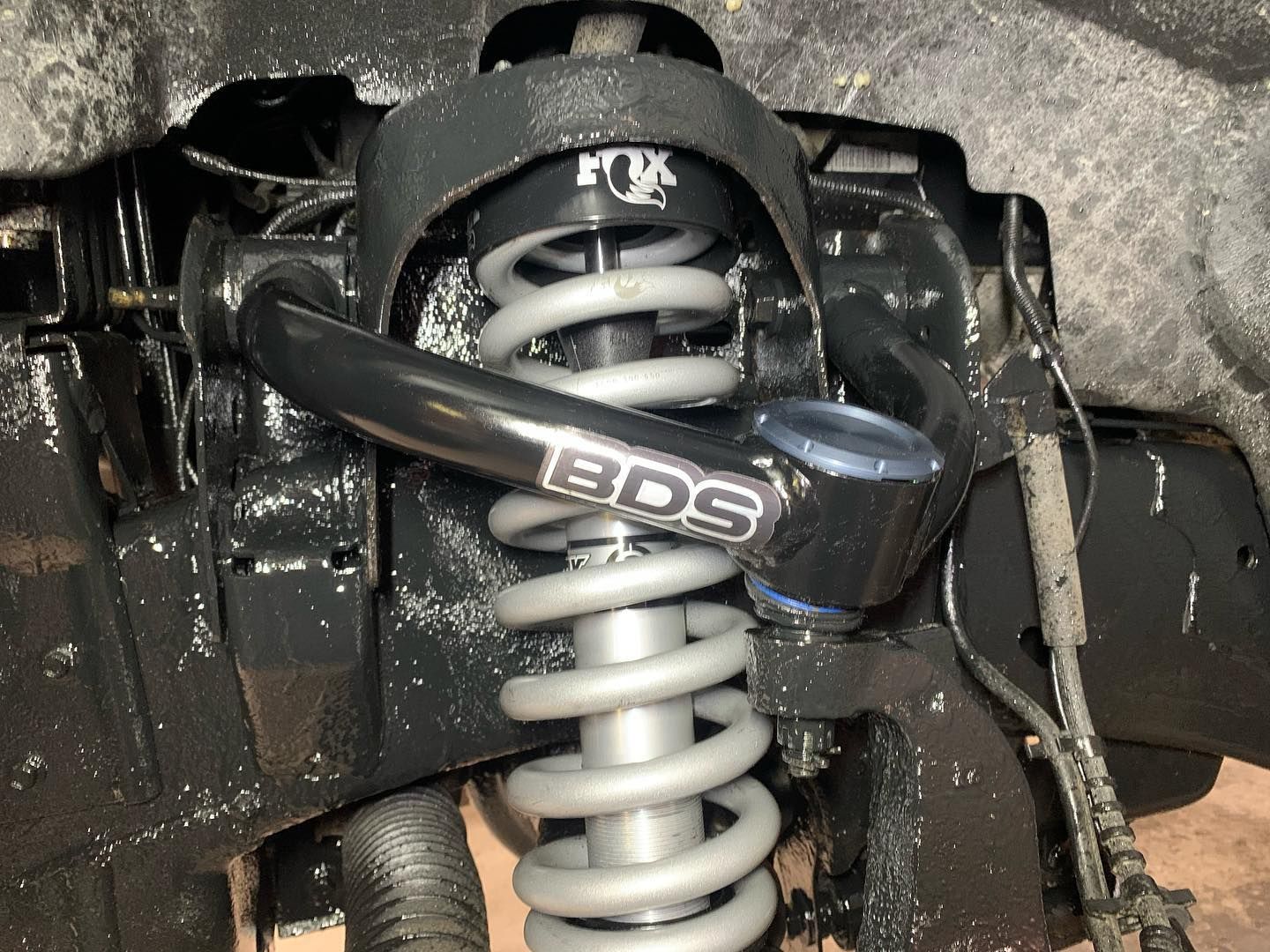 Black suspension component with gray spring and FOX and BDS branding. Black suspension component with gray spring and FOX and BDS branding.
