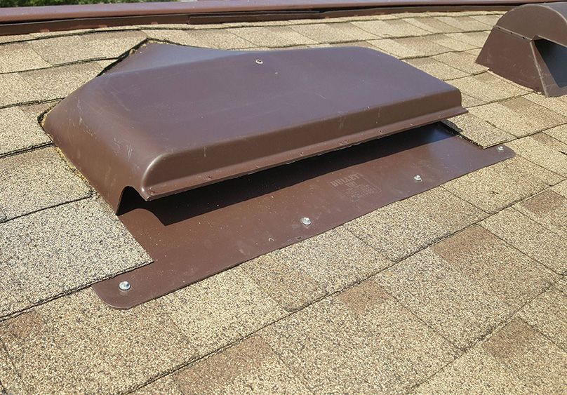 Modern Roof Vent on Shingle Surface