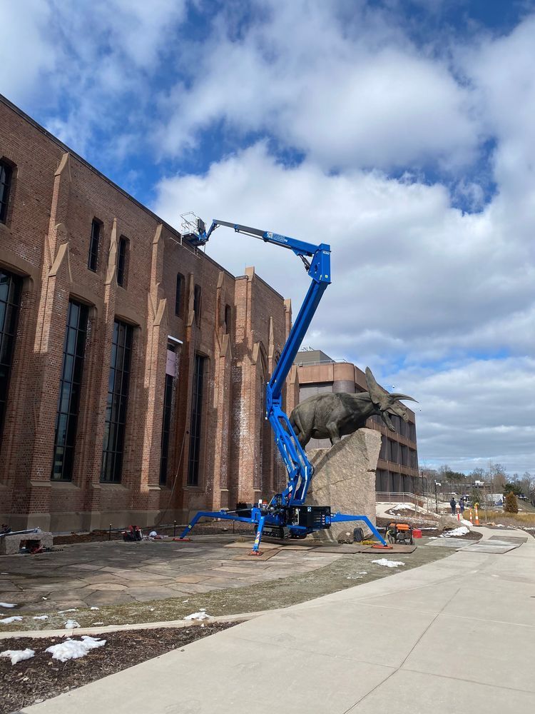 CTE Traccess doing maintenance outside a building