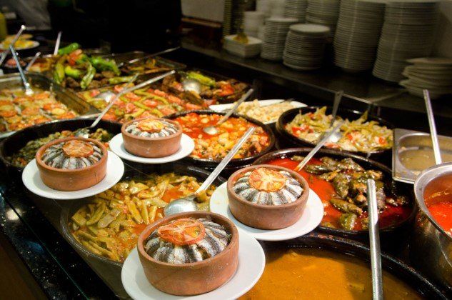 A buffet filled with lots of different types of food.