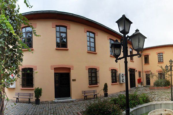 A large orange building with a lot of windows