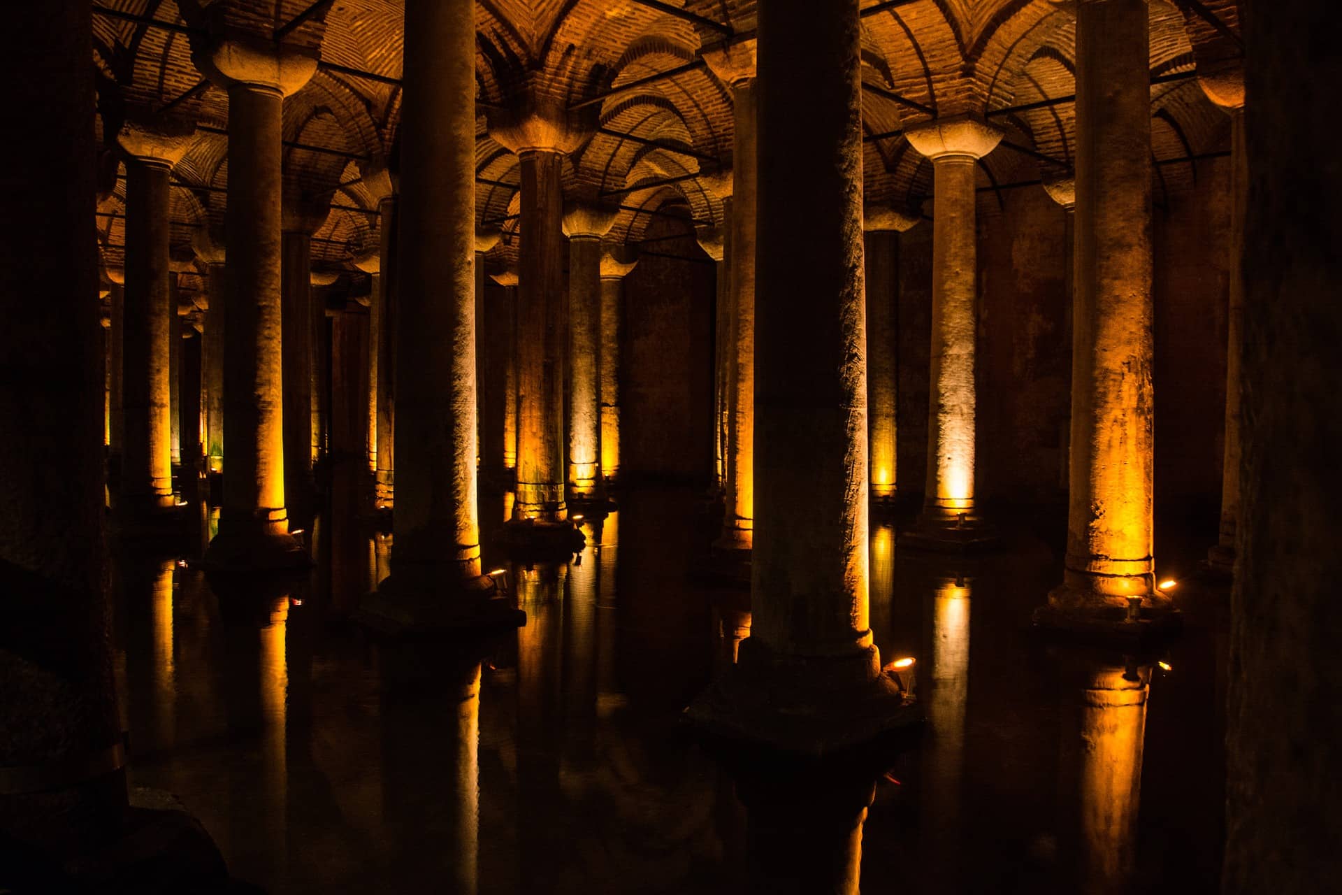 A dark room filled with columns and water at night, Yerebatan