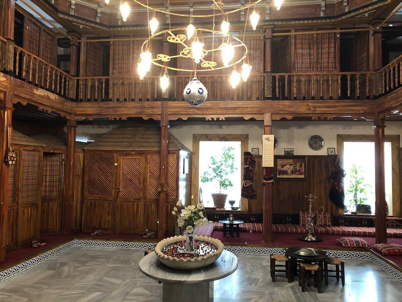 A large room with a fountain in the middle of it.