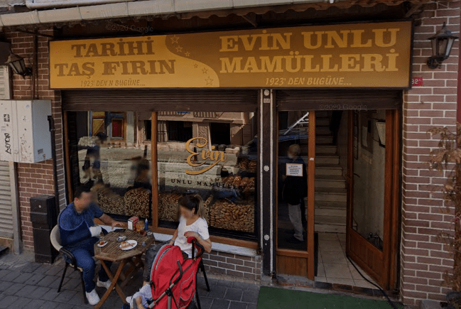A brick building with a sign that says evin unlu mamulleri