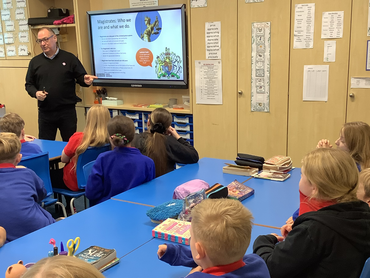 Picture of presentation to Milton St John's Primary in Mossley