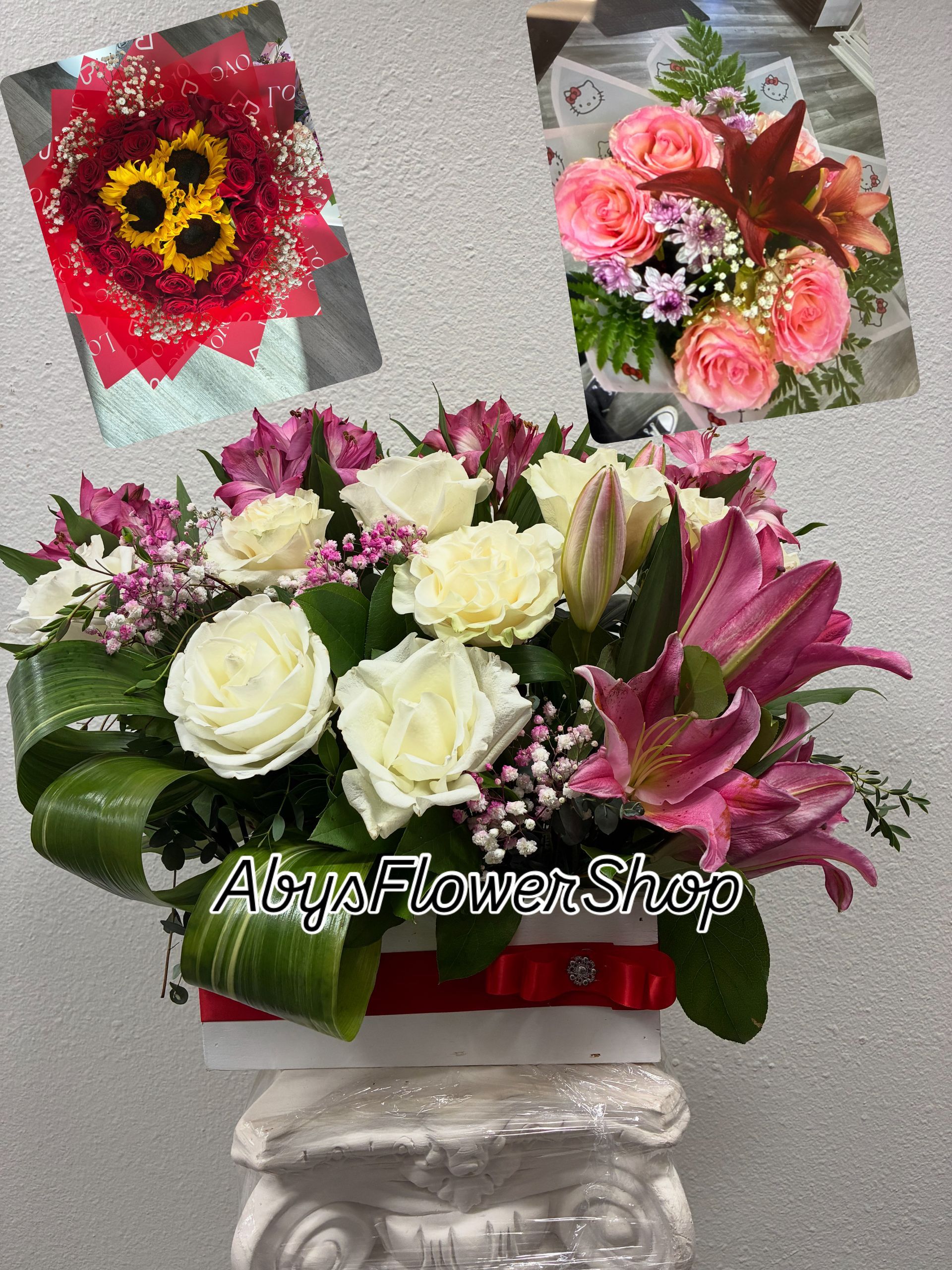 Three floral arrangements from Aby's Flower Shop, including a white box display with roses and lilies, on a pedestal.