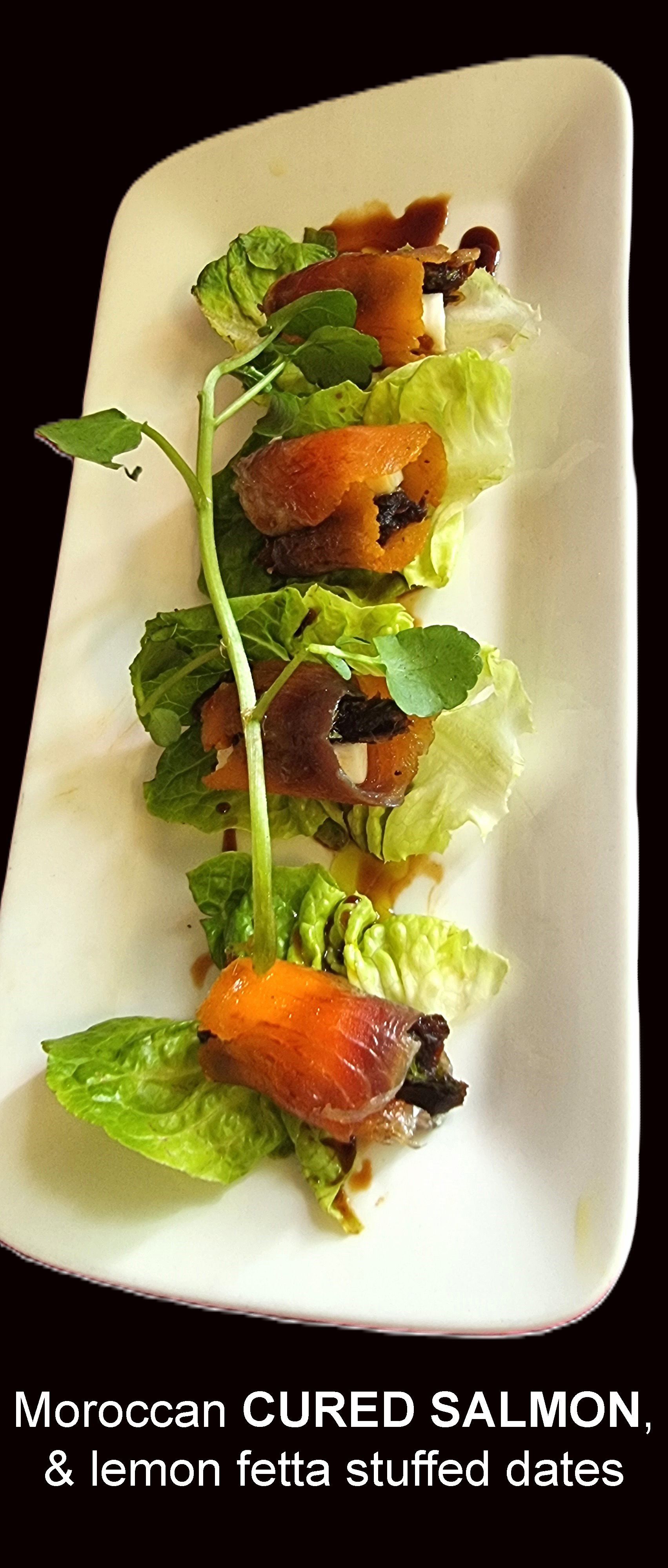 Moroccan Cured Salmon and Lemon feta Stuffed dates on a White plate — Wayne & Adele's Garden of Eating BYO Restaurant In South Townsville, QLD