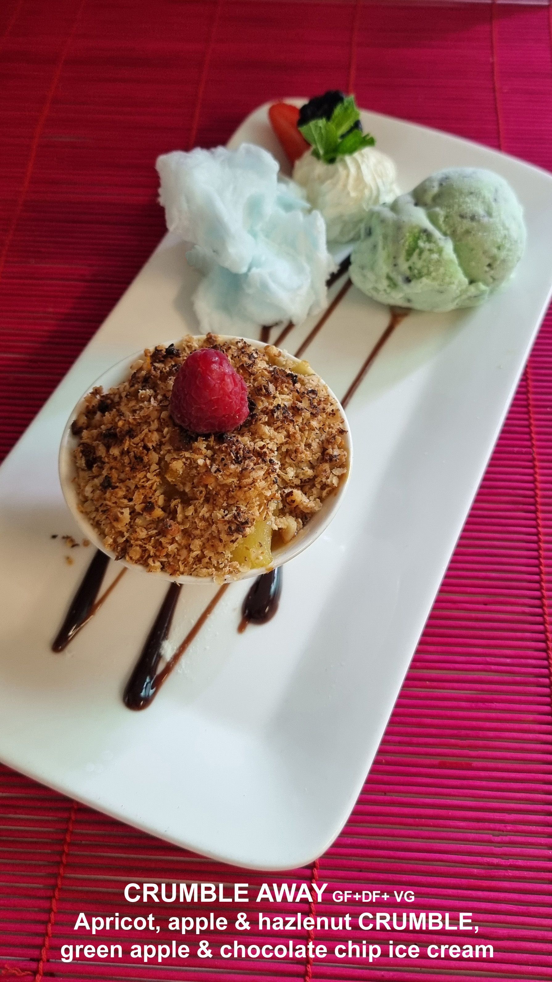 A white plate Topped with a Dessert and ice cream — Wayne & Adele's Garden of Eating BYO Restaurant In South Townsville, QLD