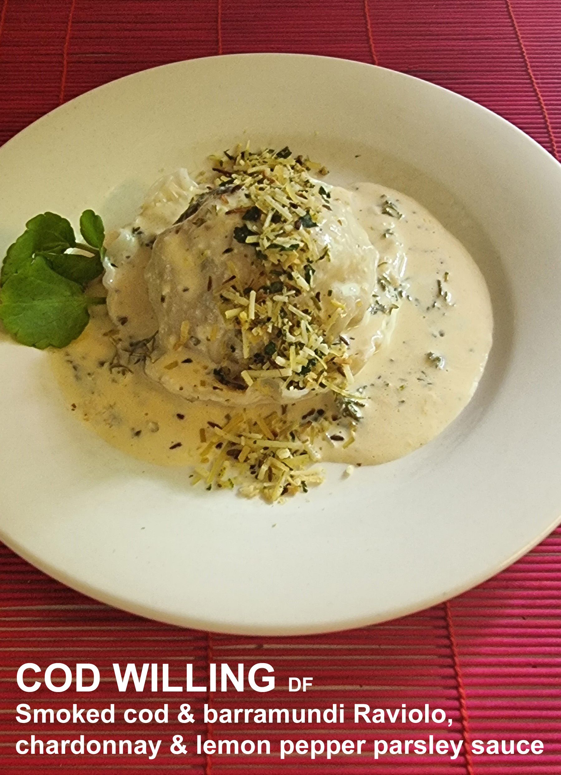 A white plate Topped with Smoked cod and Barramundi ravioli — Wayne & Adele's Garden of Eating BYO Restaurant In South Townsville, QLD